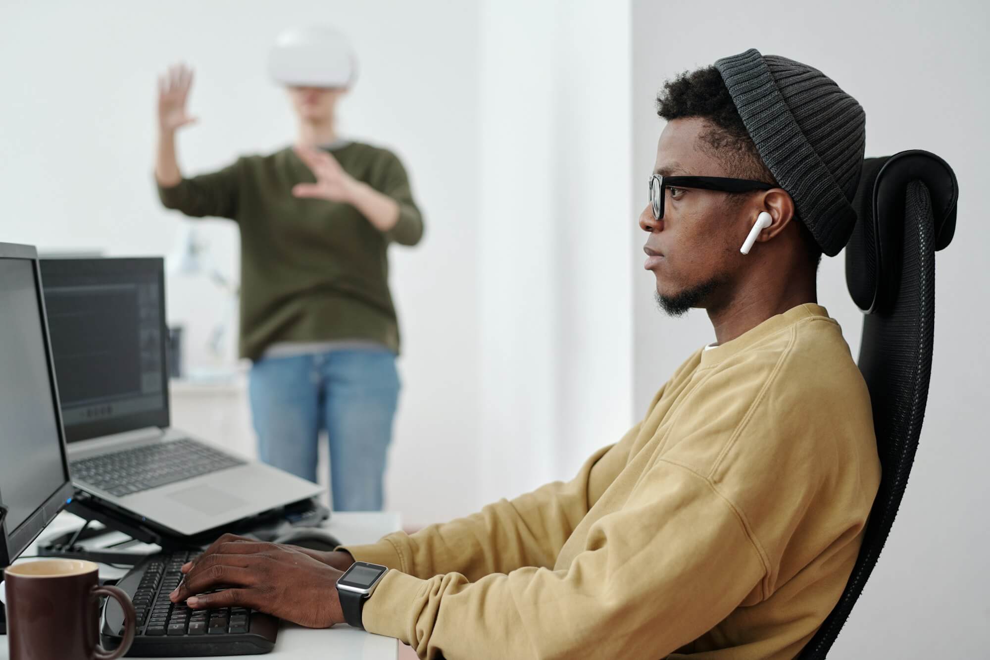 side-view-of-young-businessman-decoding-data-while-looking-at-computer-screen.jpg